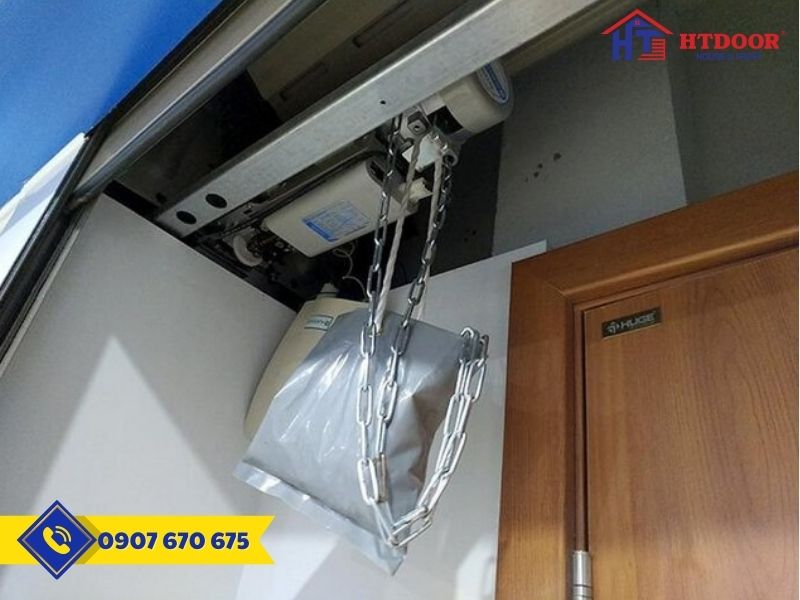 Tay gạt xích kéo motor cửa cuốn